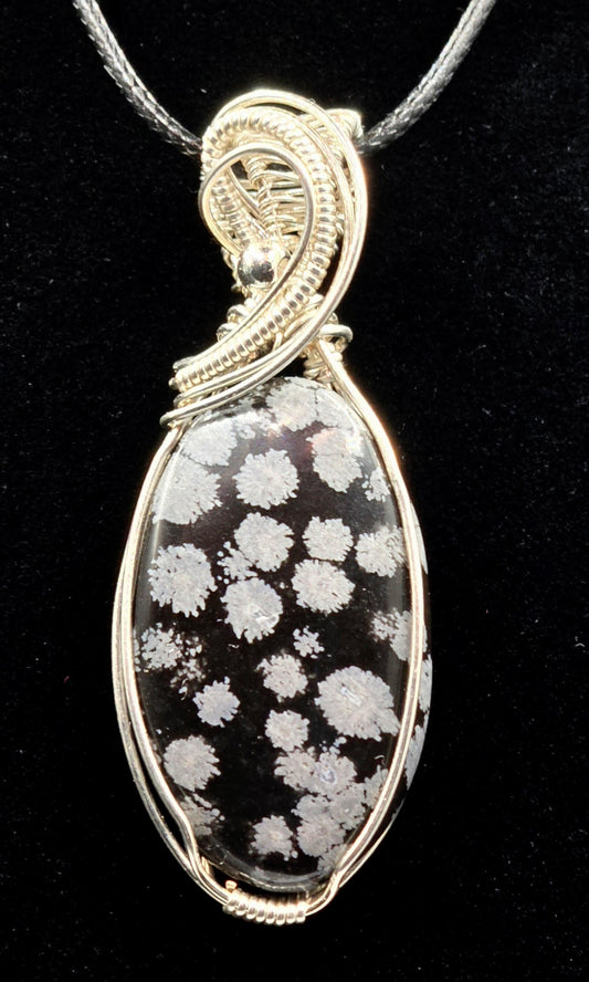 Winter Bloom – Snowflake Obsidian Pendant in Handwoven Sterling Silver