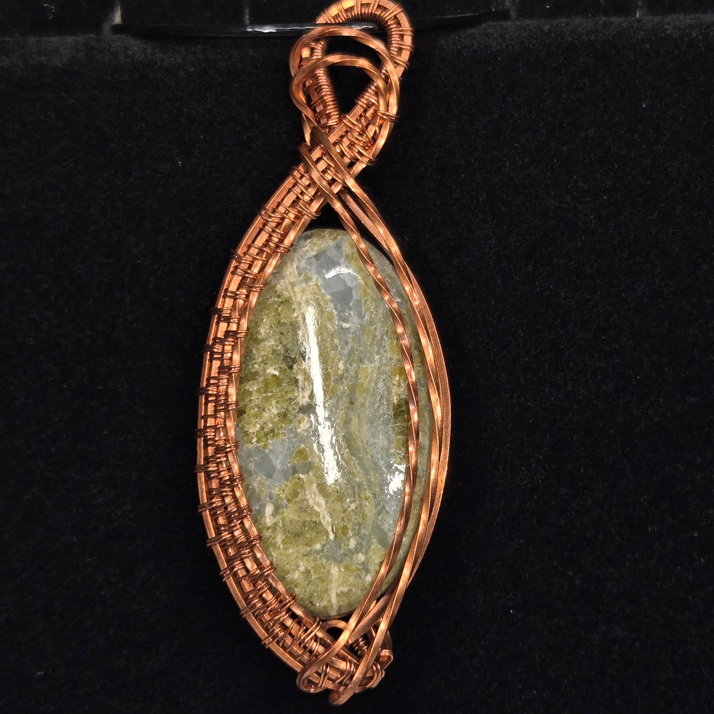 Green Serpentine Pendant with Intricate Copper Wire Weave